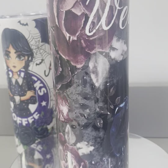 video of Wednesday Tumbler featuring the charachter in the middle, the name above with pink flowers and a black background